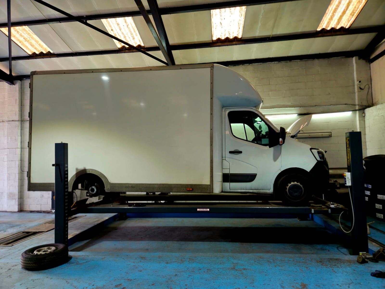Luton van raised on the MOT ramp at the Worrall Tyres workshop in Bowburn, Durham