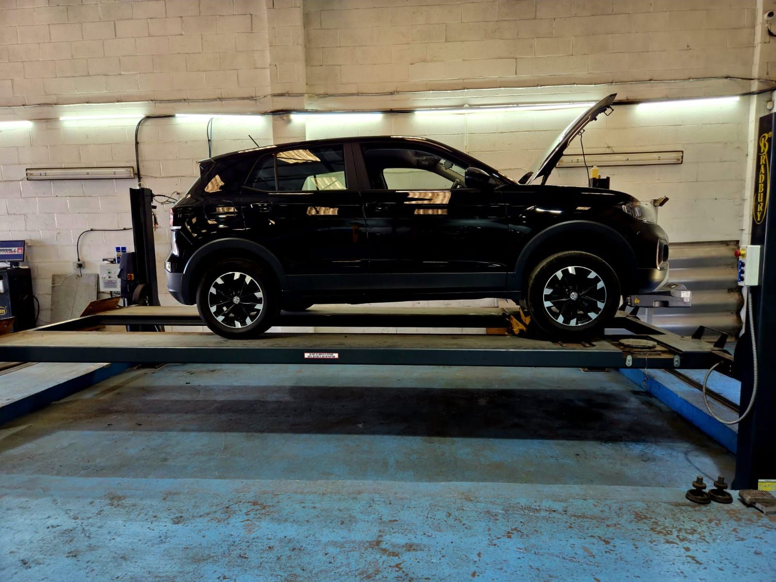 Car being worked on in the Worrall Tyres workshop